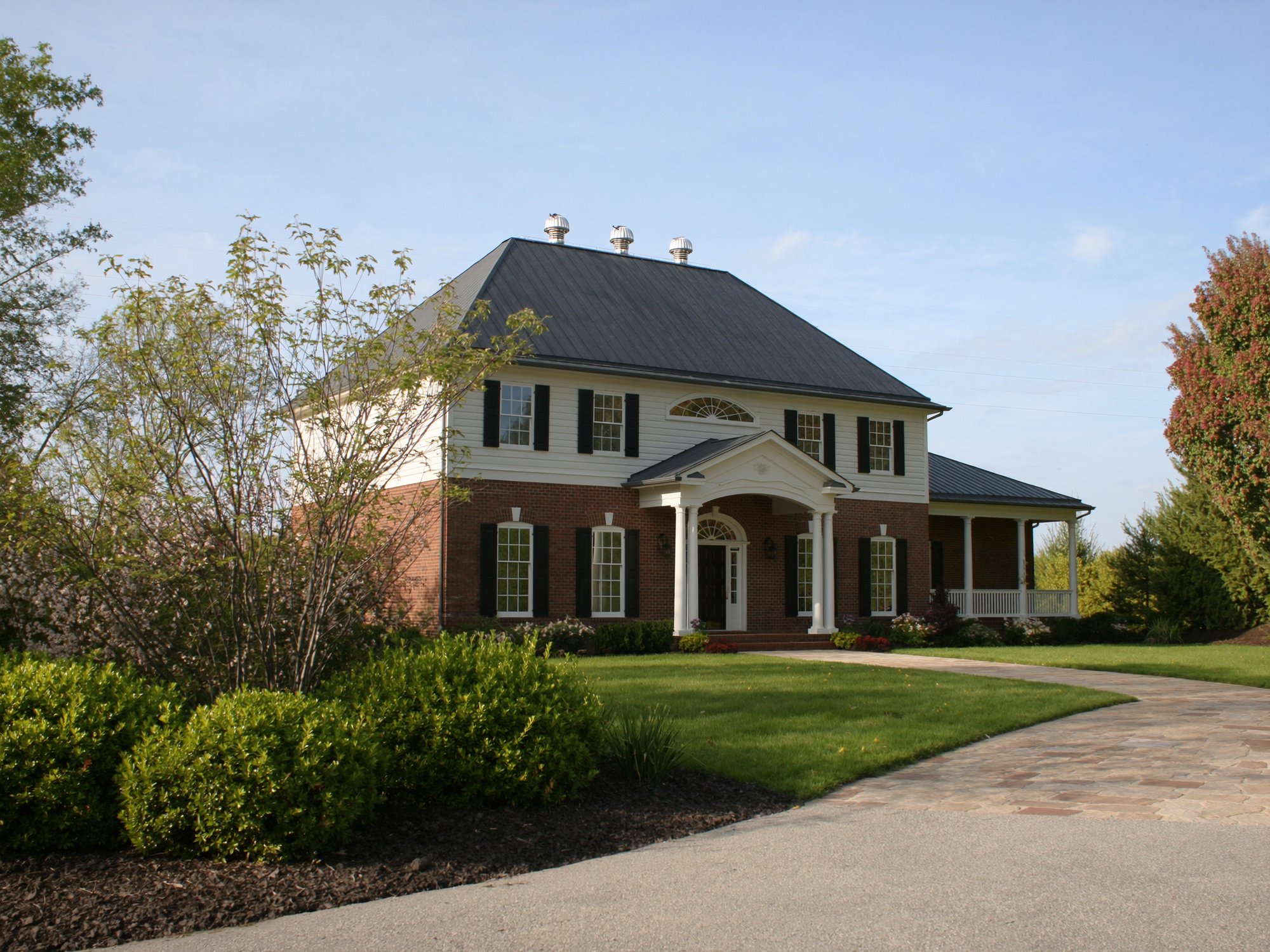 Completed roofing project on a colonial home in Warrensburg, MO
