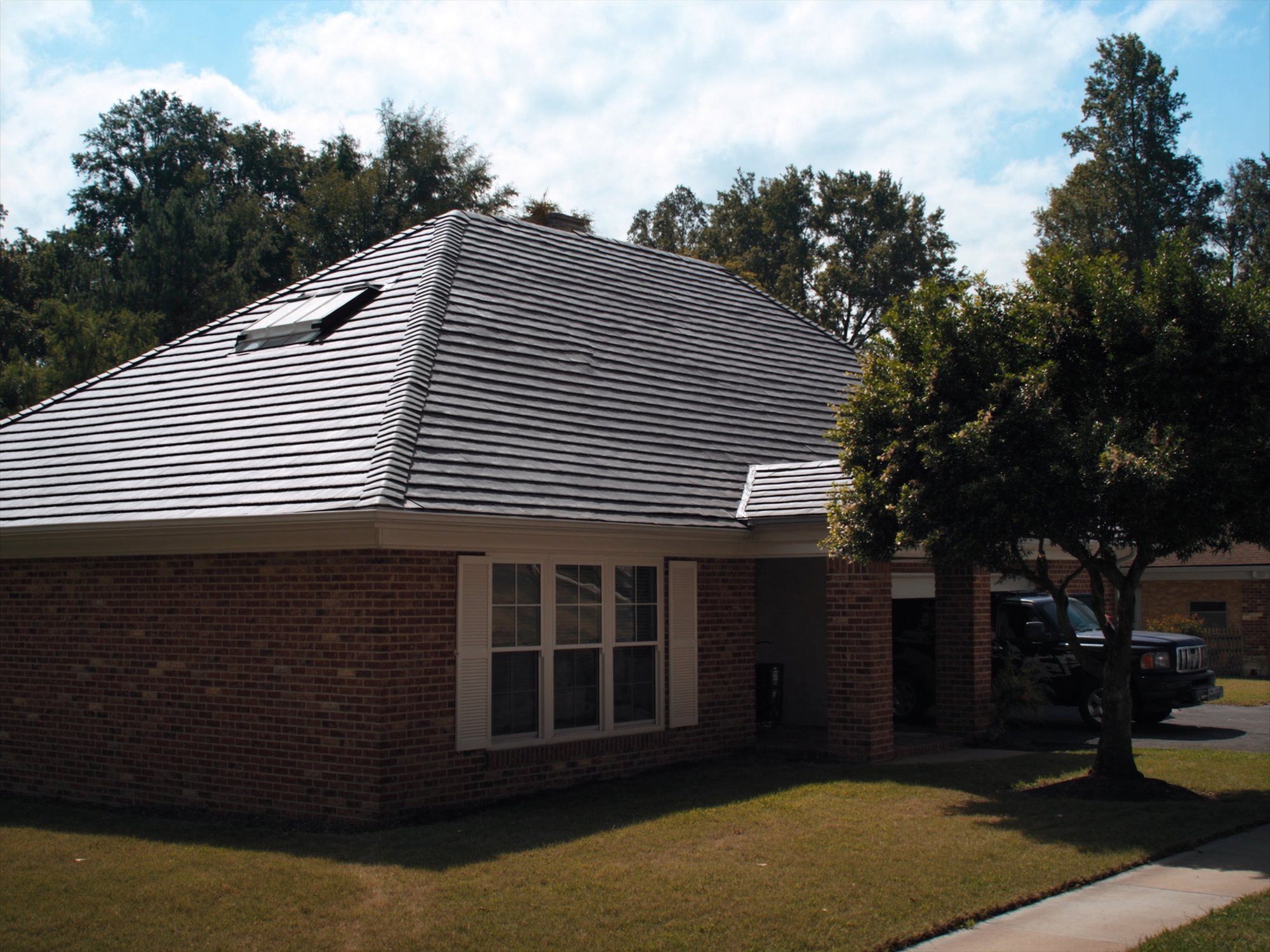 Full roof replacement project on a brick home in Clinton, MO