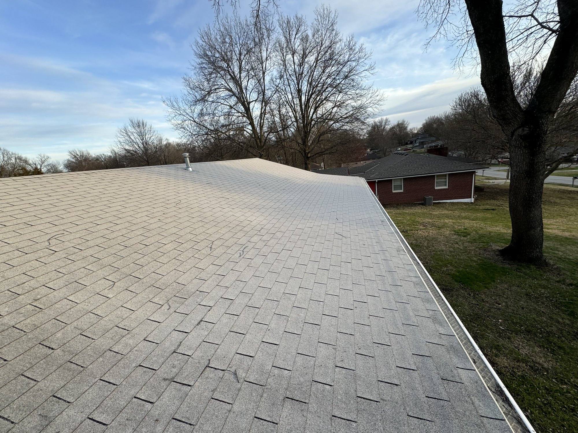 Ranch-style Missouri home with brand-new charcoal asphalt shingle roof
