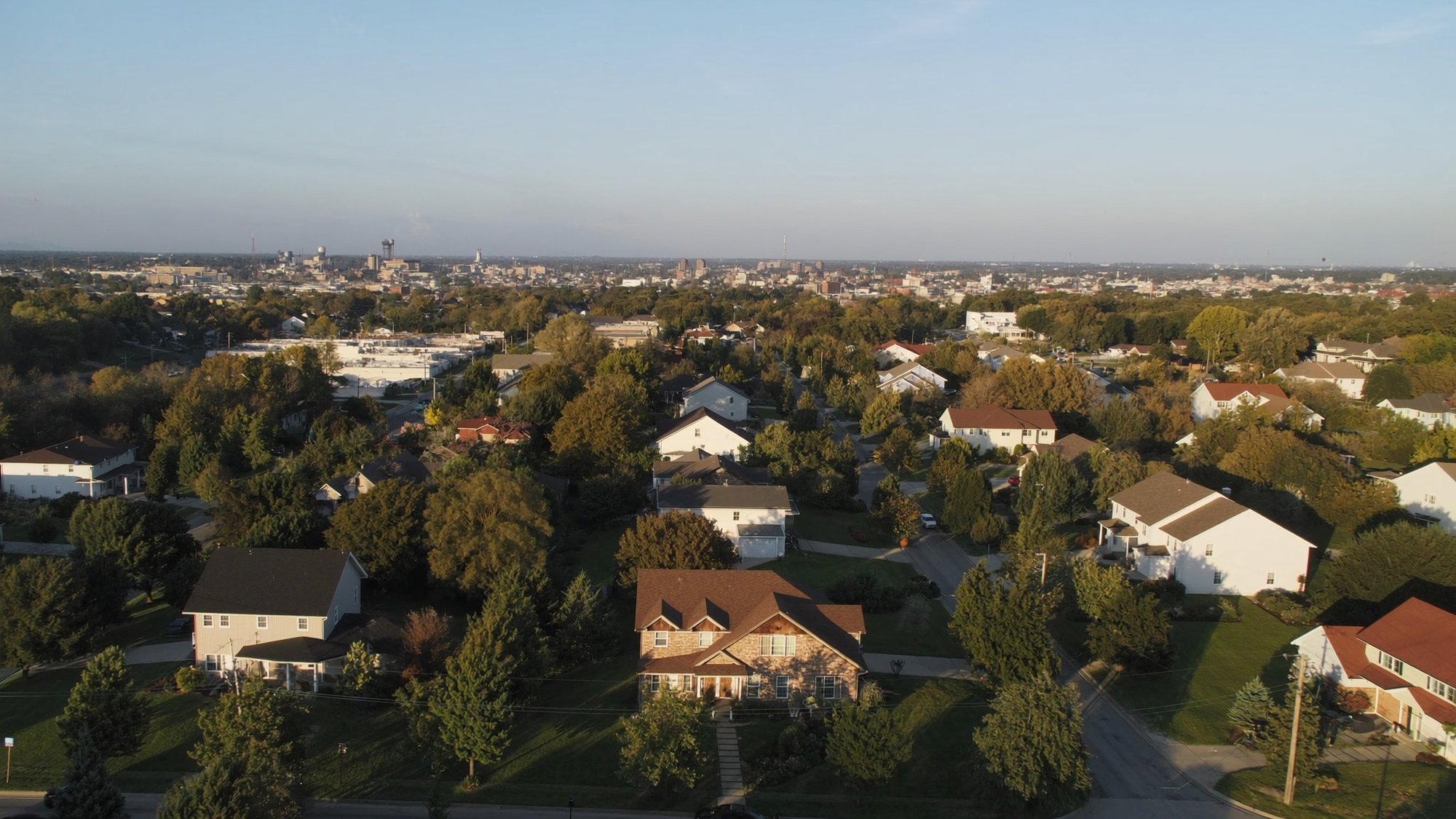 Aerial view of a residential neighborhood with completed roofing projects in Central Missouri